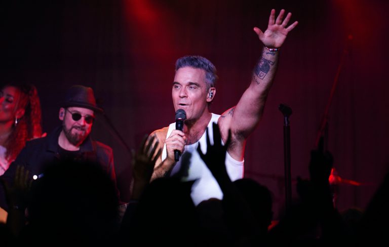 Robbie Williams teases future reunion with Take That: “I’m sure we will ride again”