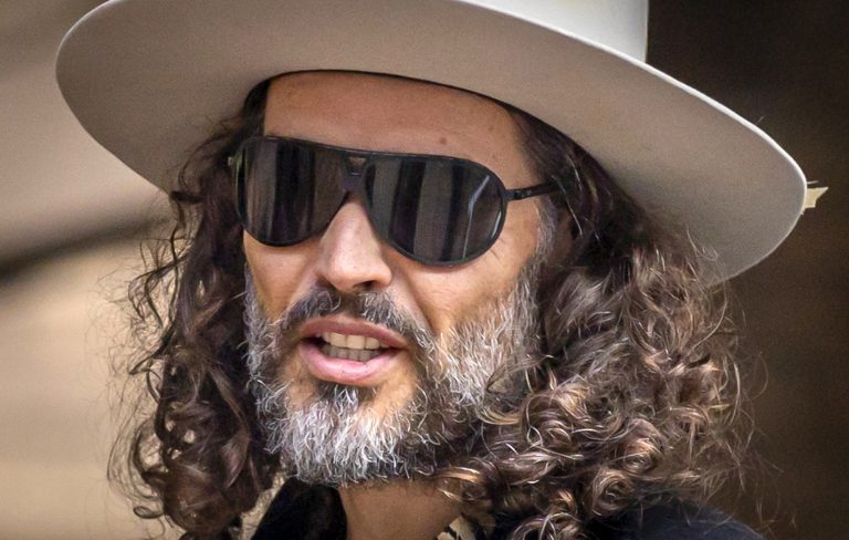 Russell Brand’s rape trial delayed for six months
