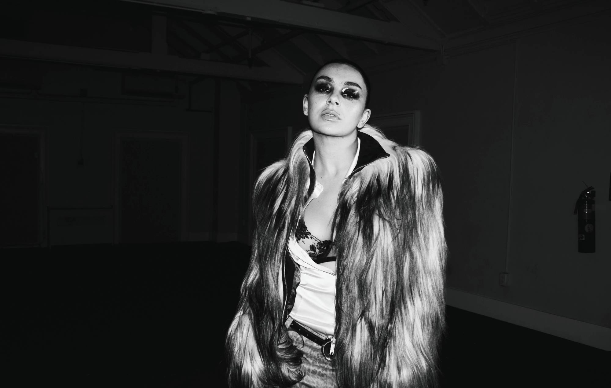 Charli XCX walks Paris runway “straight to hell” on gritty new single ‘SS26’