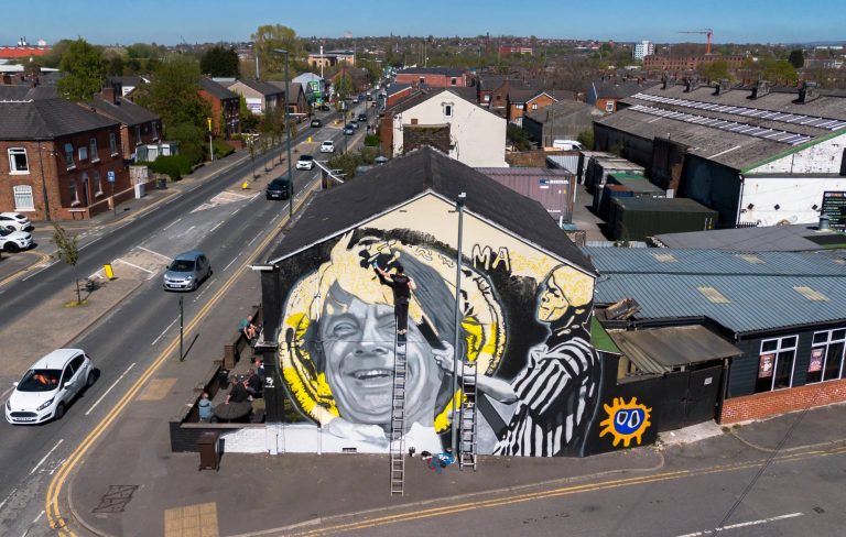 Mural to The Stone Roses icon Mani unveiled in Manchester: “He was, and always will be, adored”