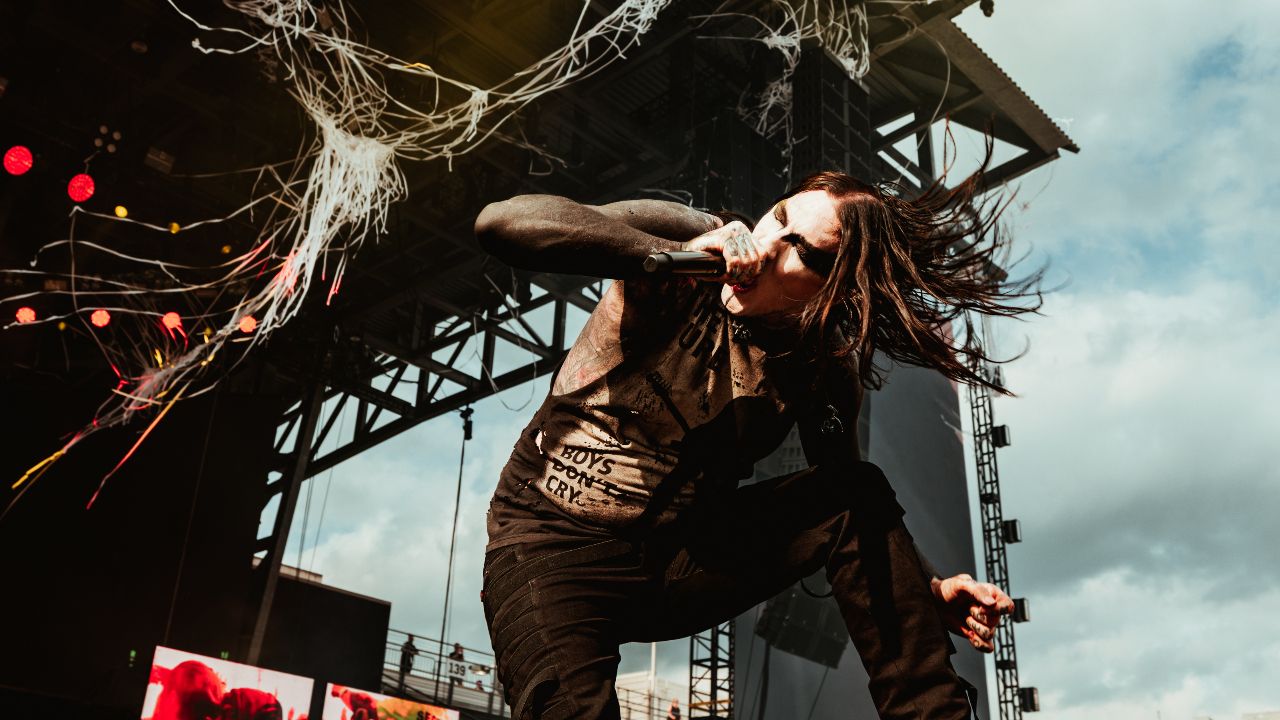 “We spot a man in a cowboy hat twirling another on his shoulders like he’s trying out for WWE.” Goth metalcore heavyweights Motionless In White smash their headline audition in front of one of Sonic Temple’s rowdiest crowds