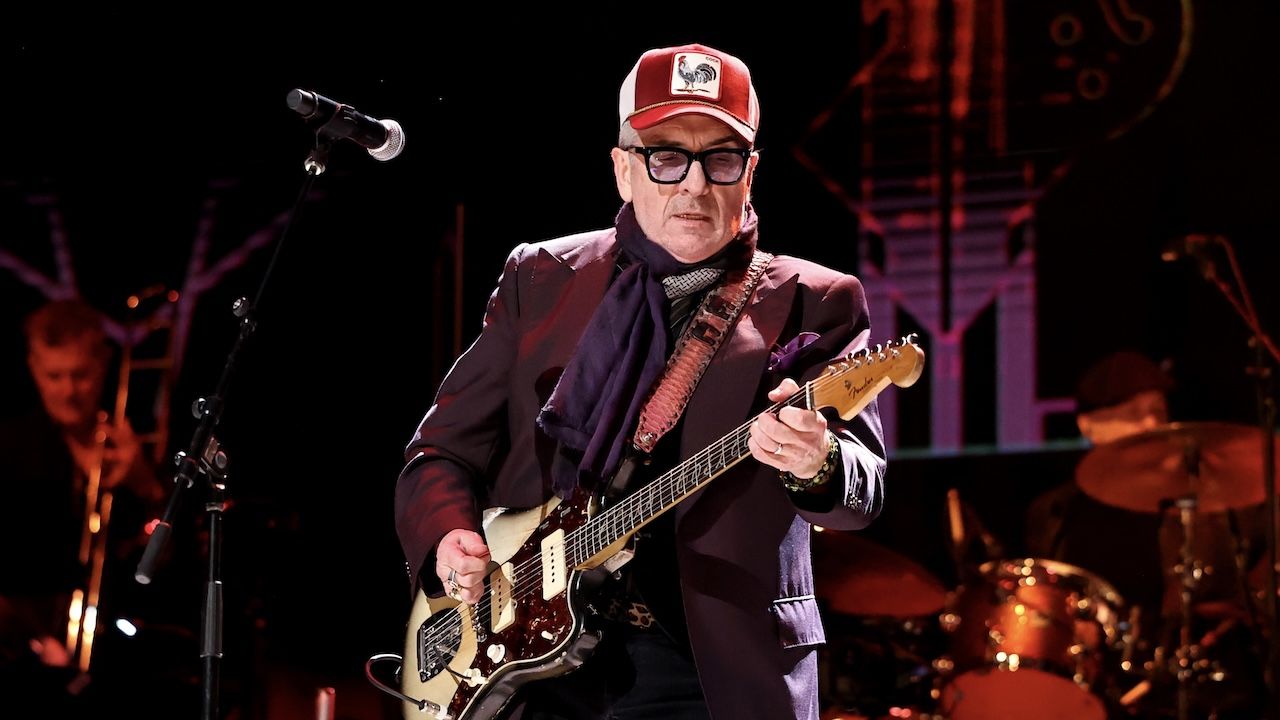 “People went, ‘That’s woke.’ Well, go f*** yourself.” Elvis Costello explains why he’s rewritten the most controversial lyric in his provocative 1979 single Oliver’s Army and is playing it live again