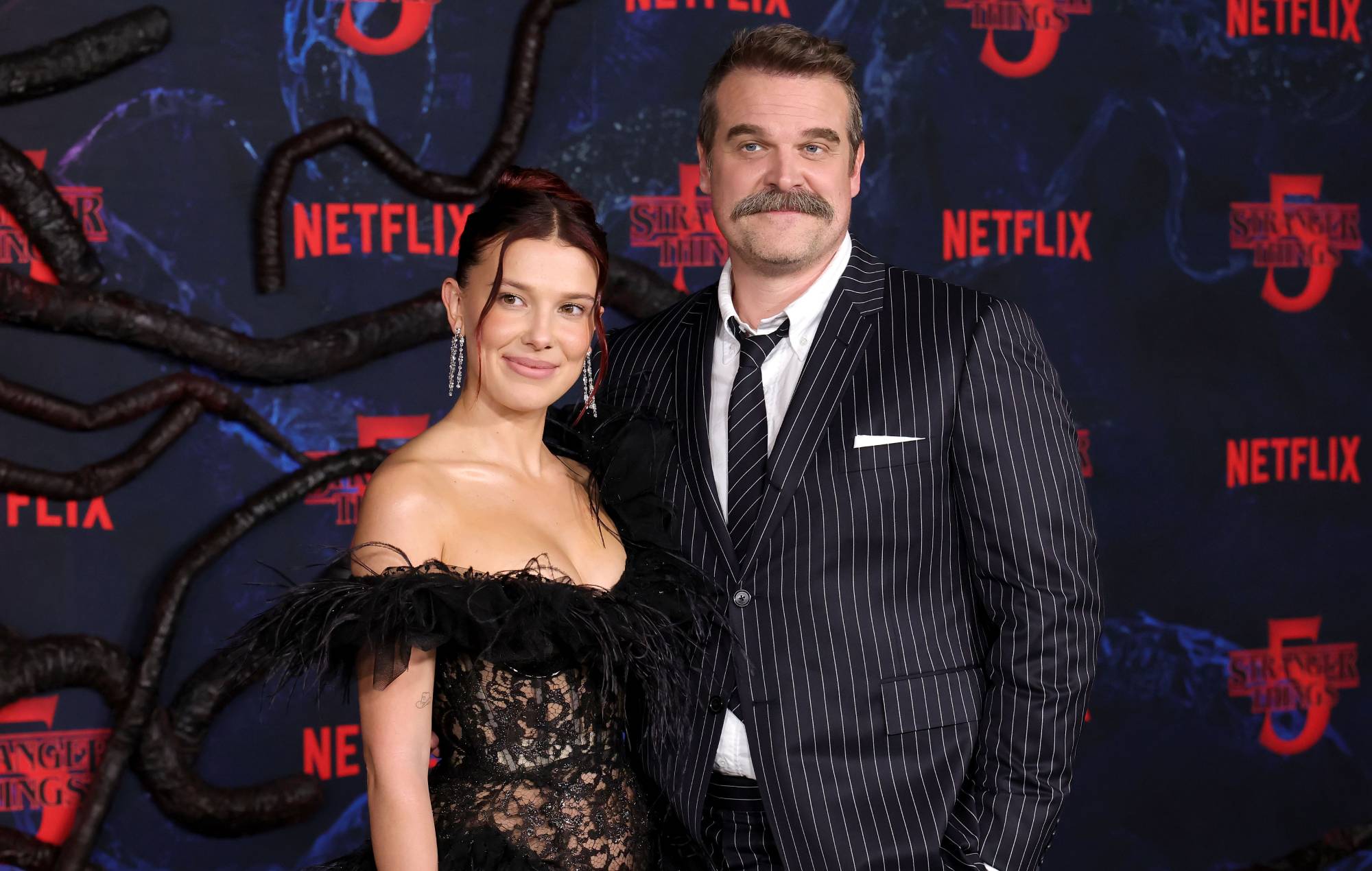 David Harbour says he and Millie Bobby Brown “still adore each other” after harassment allegations as they both speak out