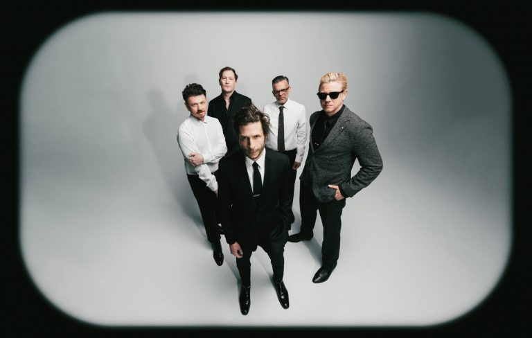 Interpol stare down AI on atmospheric new single ‘Iron City’