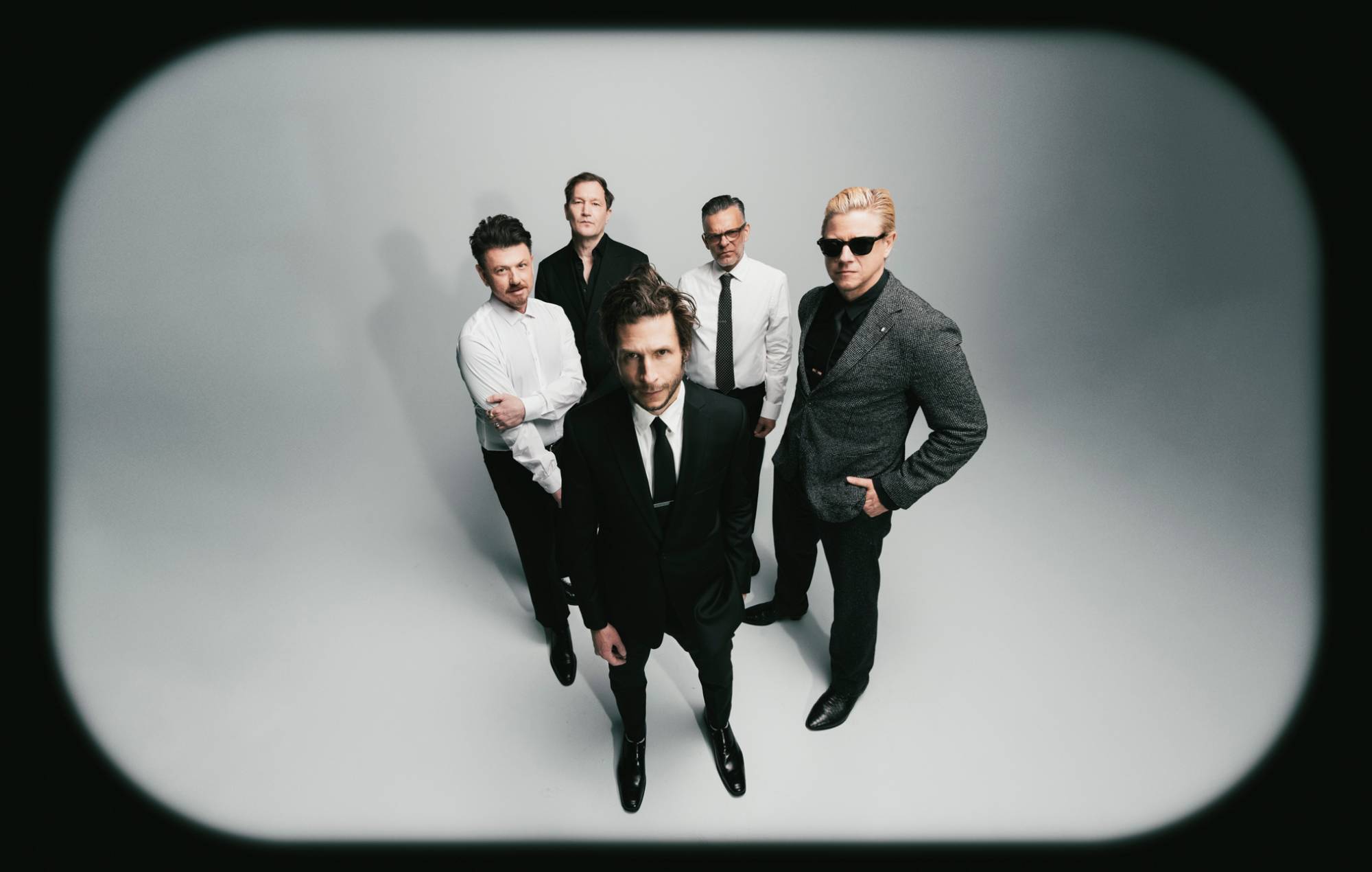 Interpol stare down AI on atmospheric new single ‘Iron City’