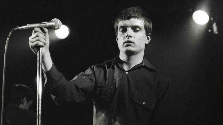 “We would just have done it balls out, legs akimbo like Status Quo. and probably messed it up”: The classic song that gave an iconic post-punk band their biggest hit – and became an epitaph for their tragic singer