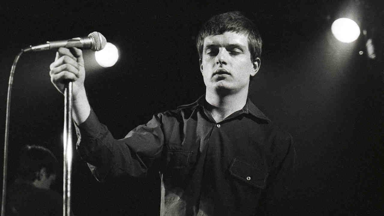 “We would just have done it balls out, legs akimbo like Status Quo. and probably messed it up”: The classic song that gave an iconic post-punk band their biggest hit – and became an epitaph for their tragic singer