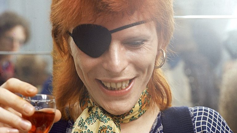 “Once we realised the guys with guns pointed to our heads were cops, we were relieved.” The night that armed police gatecrashed David Bowie’s end-of-tour party