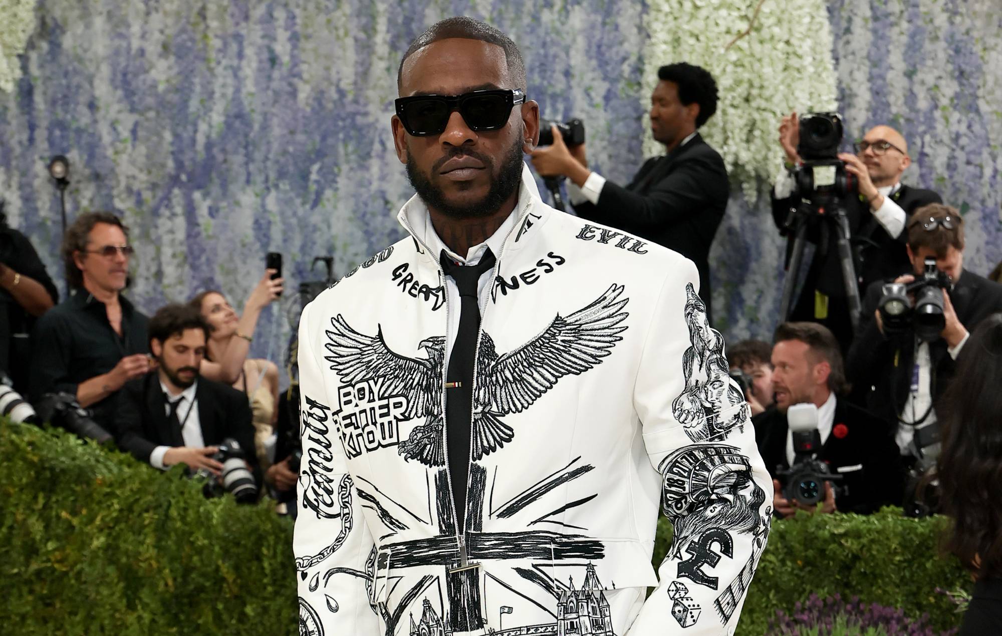 Skepta responds to old photo of himself posing with Israeli flag: “I was young and naive”