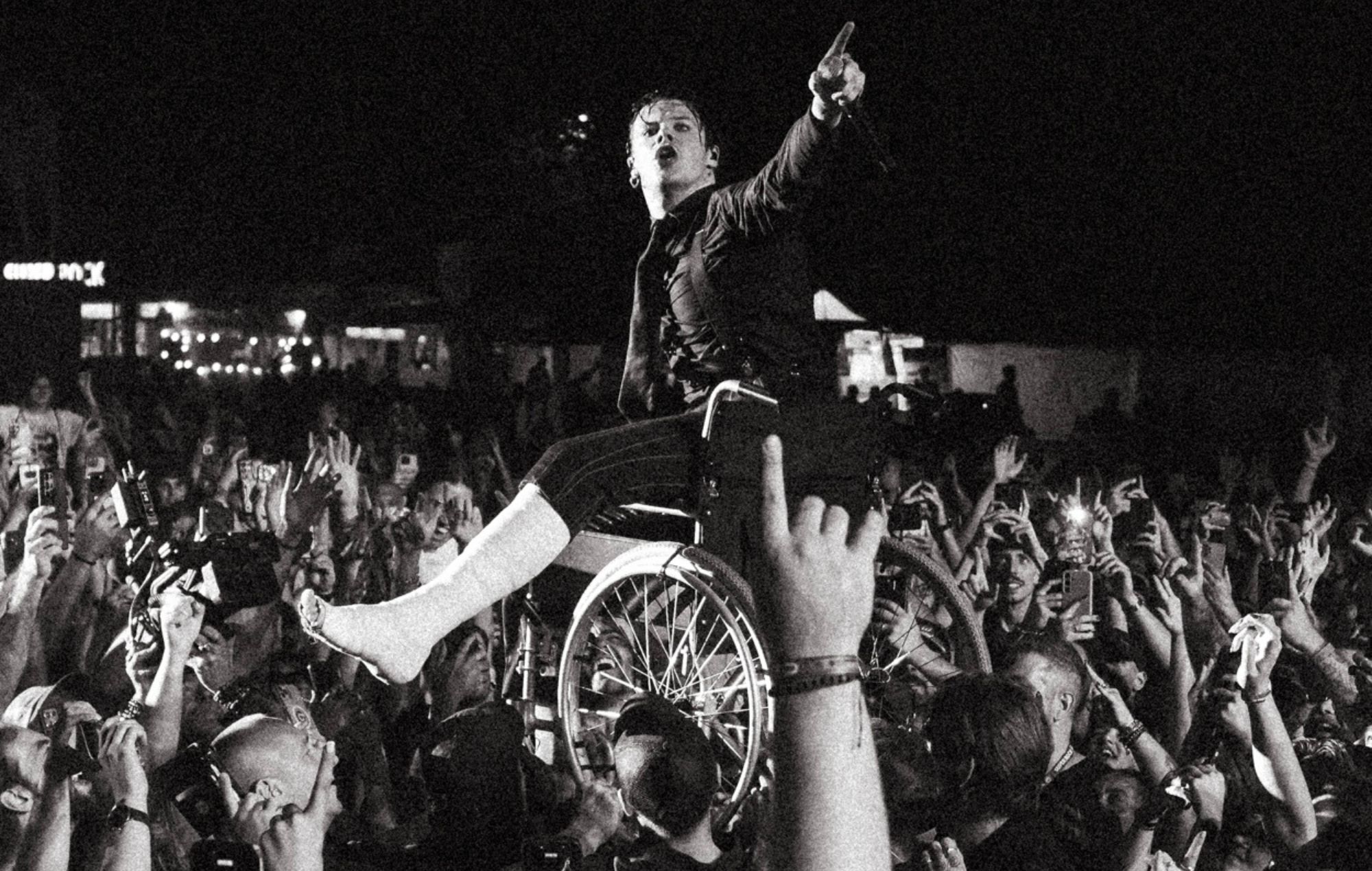 Watch Yungblud crowdsurf in a wheelchair after breaking his leg